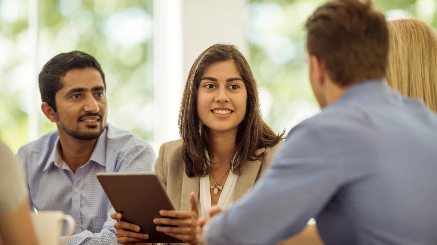 men and woman in a meeting